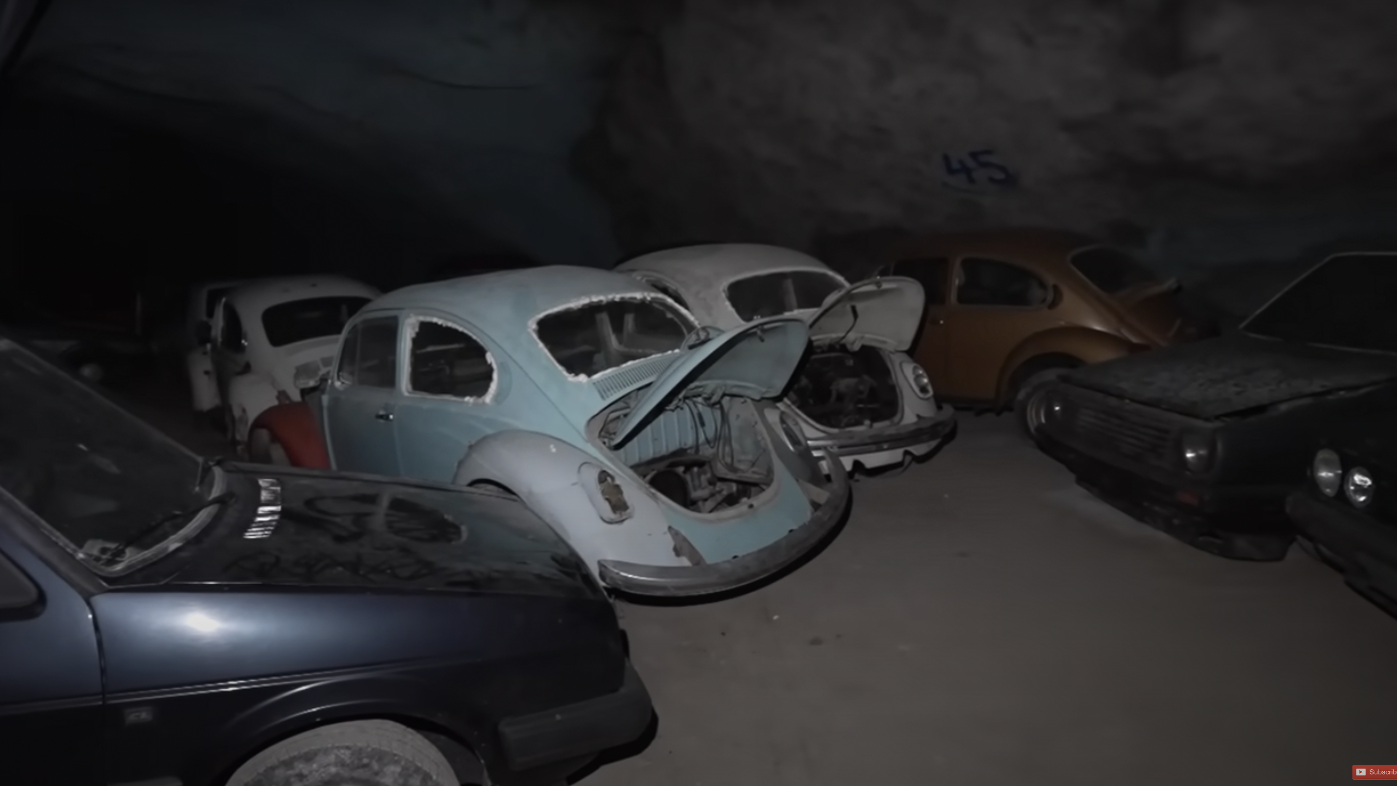 Abandoned classic Volkswagens in a mine